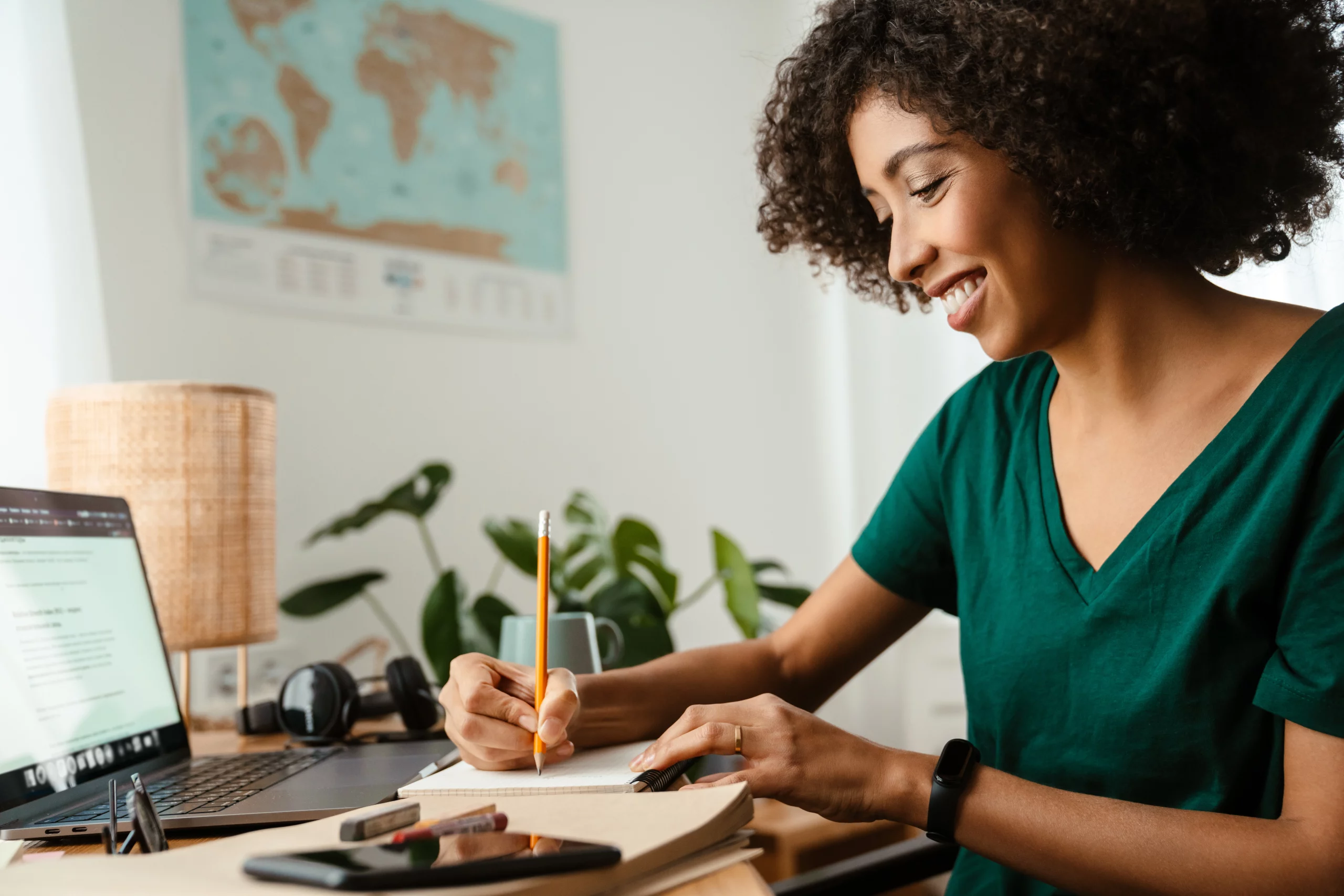 african-american-young-woman-using-laptop-and-taki-2022-11-29-02-39-24-utc